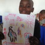 Hope with her baboon drawing