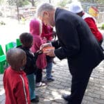 Paul handing out communion to the children