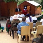 Paul the pastor giving a sermon with audience