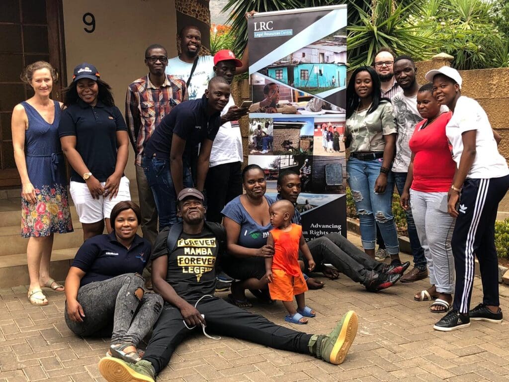Group of people posing with a LRC banner