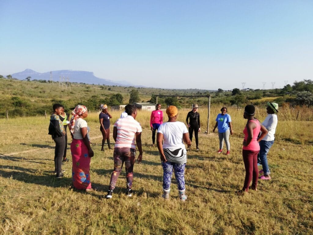 Group of woman practicing on a soccer field