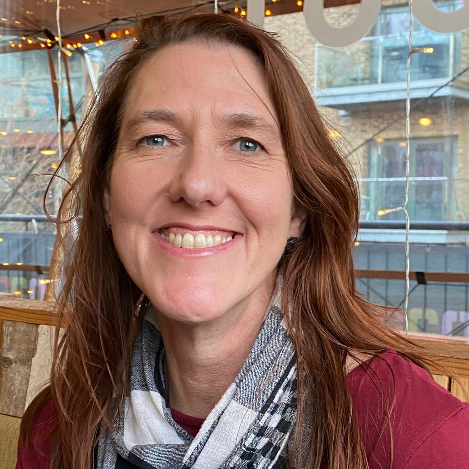 Head and shoulders photo of a woman smiling
